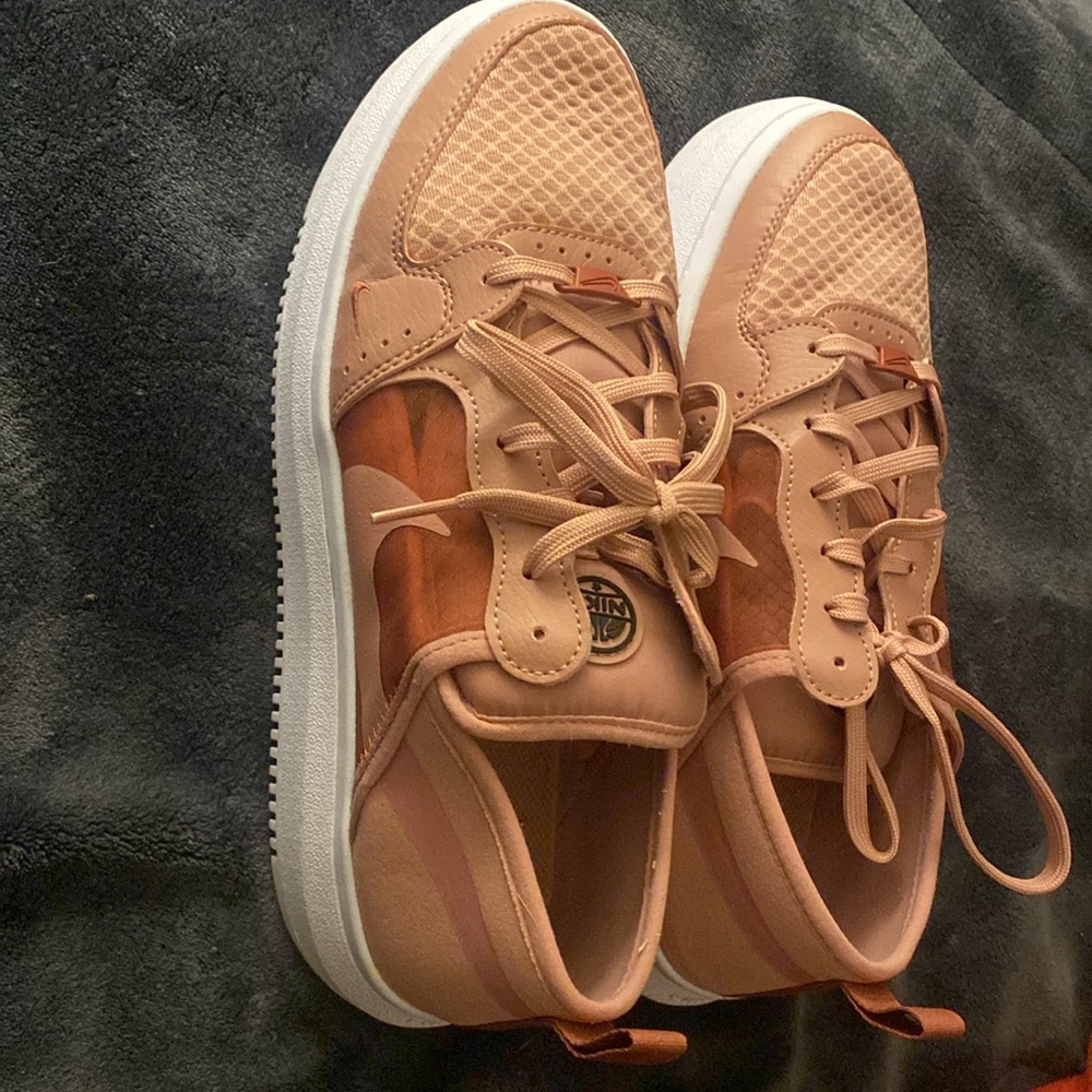 Size 10 Nike Shows. Rosey pink with a cute mesh side detail. Slight platform.